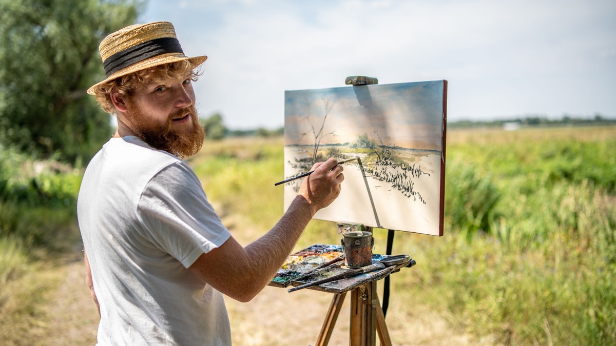 Phillipp Hiller an der Staffelei in der Landschaft